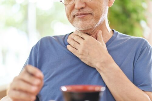 Elderly man with dysphagia. Elderly choking incidents are a serious risk in nursing homes.